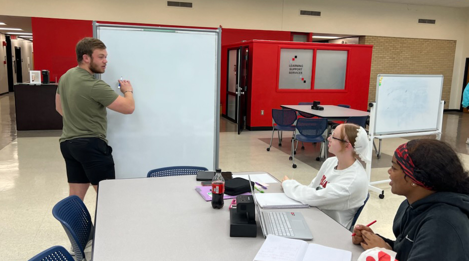 photo of Ramsey Brower with students